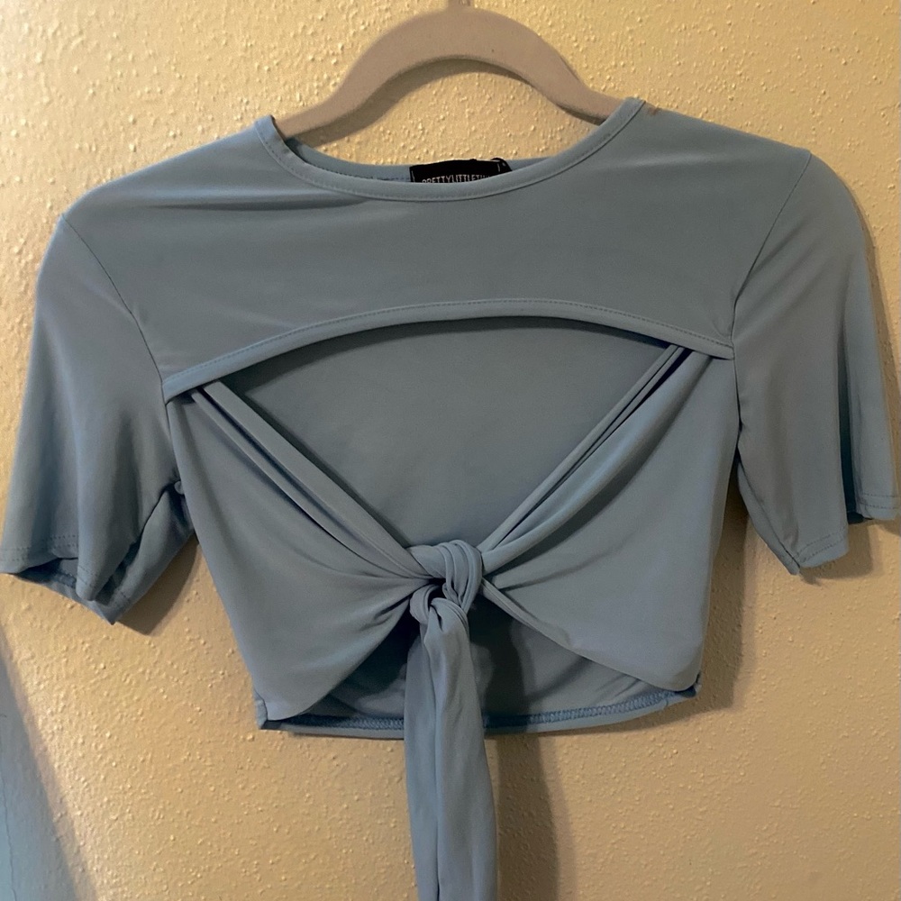 light blue front tie croptop peekaboo lining. Perfect for brunch with blue jeans